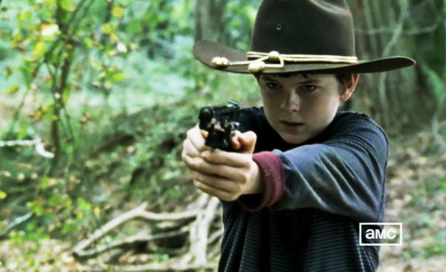 Carl with a gun