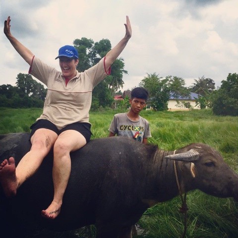 Tara trying out some new transportation in Malaysia.