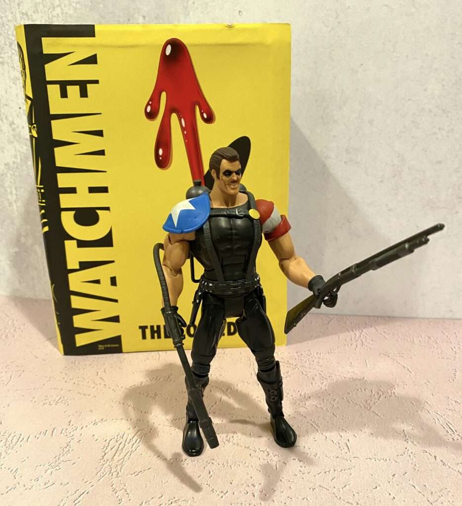 The Comedian action figure with gun and flamethrower