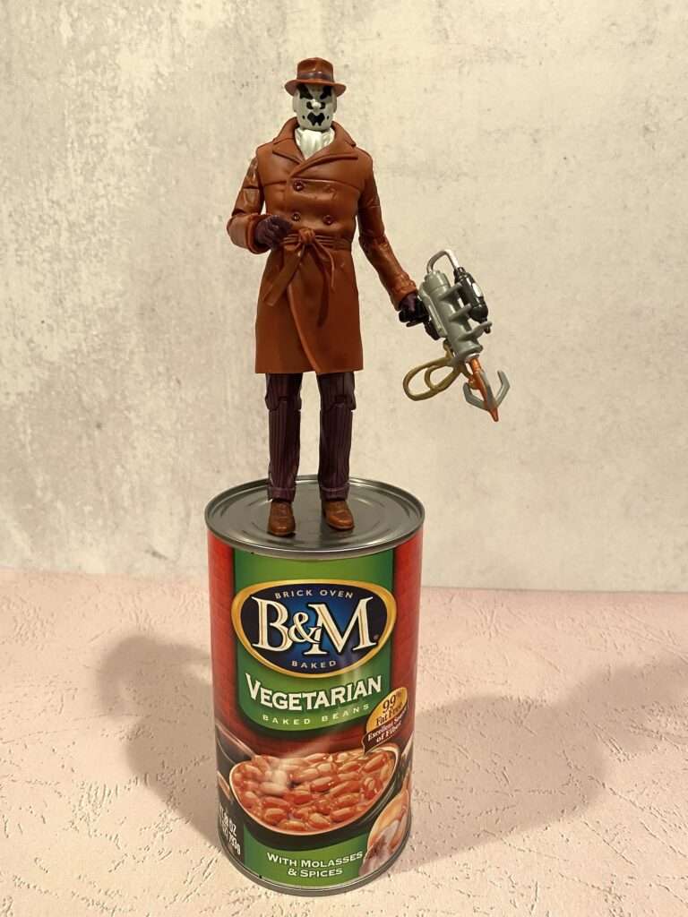 Rorschach action figure on a can of beans