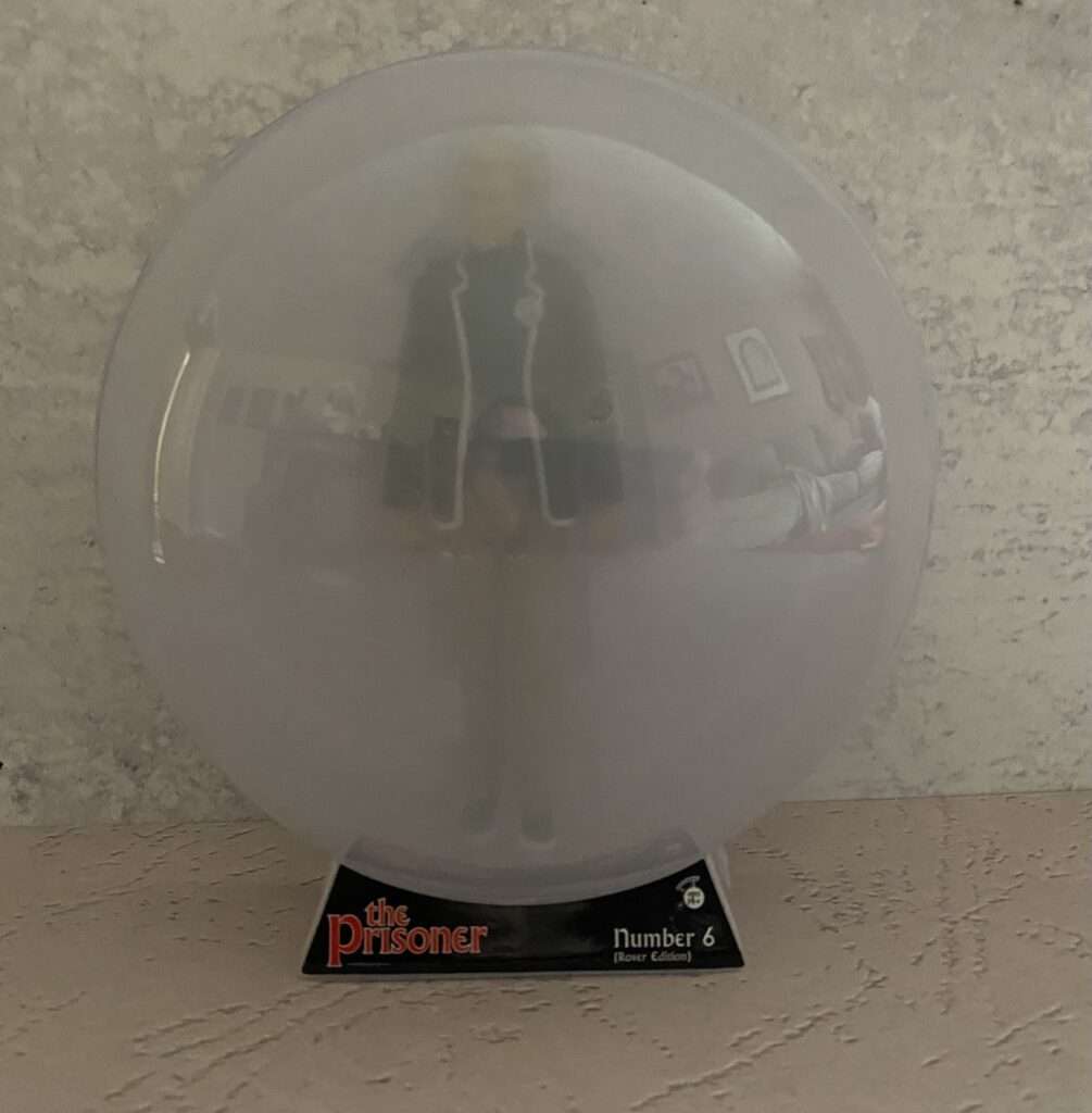 Prisoner action figure trapped in Rover clamshell packaging
