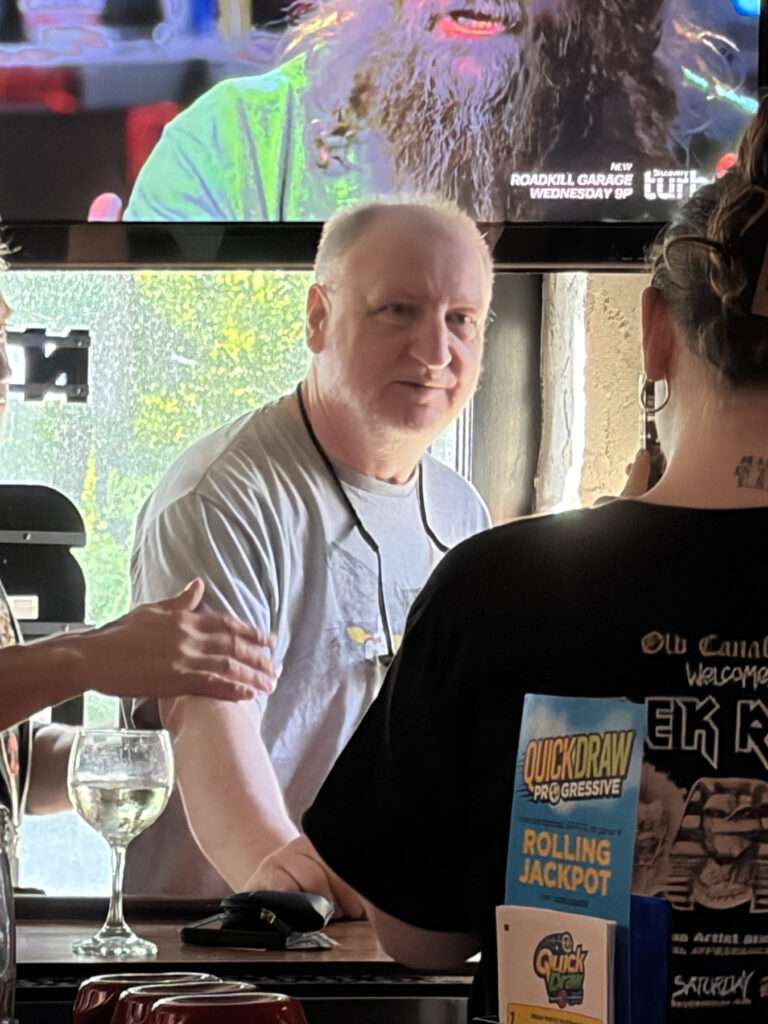 Derek Riggs at the bar of the Old Canal Inn